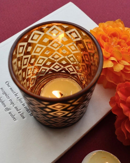 Decorative Candle Holder With A Lit Candle On A Book With Flowers And Text