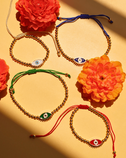 Beaded Evil Eye Bracelets on a Yellow Background