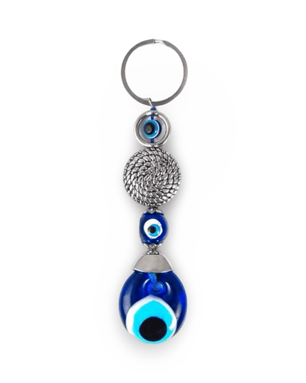 Keychain with blue evil eye design on a white background