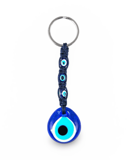 Blue evil eye keychain with navy macrame on a white background