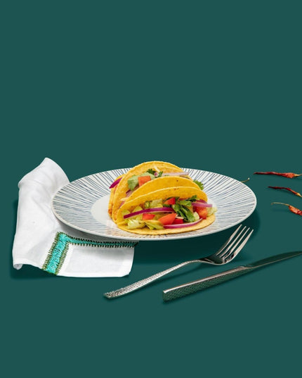 Nadia Dafri White Cotton Hand-Embroidered Turquoise Napkin Hammered Silver Fork Knife White Dinner Plate Blue Stripes