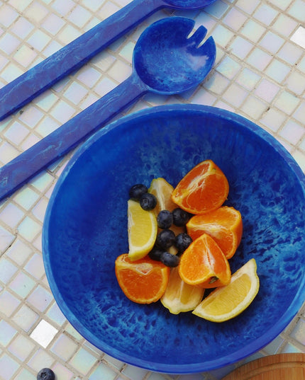 Blue Resin Salad Bowl With Fruit And Salad Servers On The Side