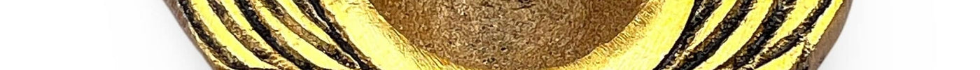 Gold metal diya holder from India