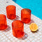 Casa Duniya's Red Dhari Water Glasses Set at the Poolside with an Orange