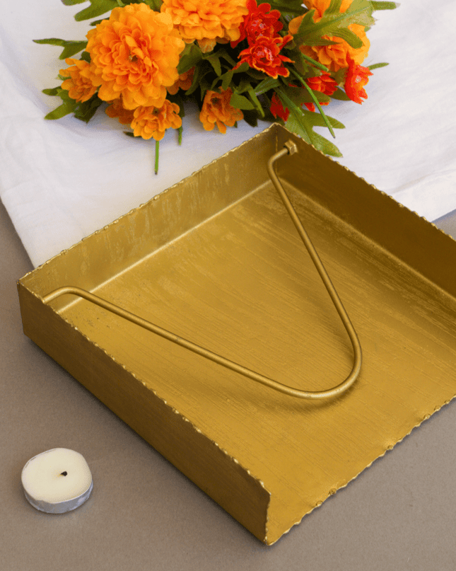 Brushed Gold Napkin Holder with Orange Flowers in Background