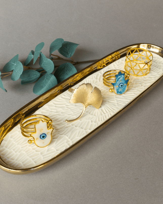 Porcelain tray with napkin rings on a gray background