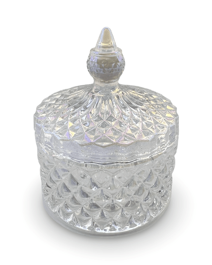 Decorative clear glass jar with a prism-cut design and a small finial on a white background