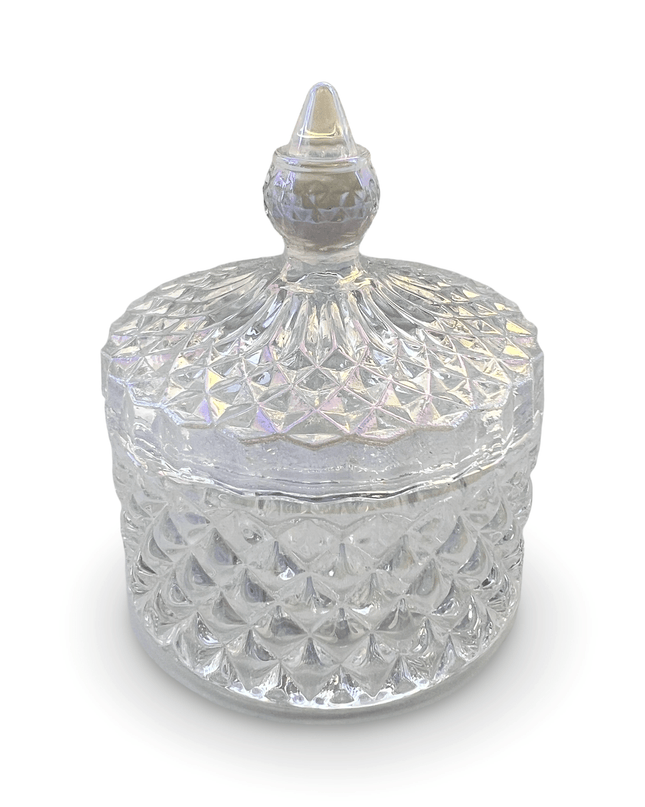 Decorative clear glass jar with a prism-cut design and a small finial on a white background