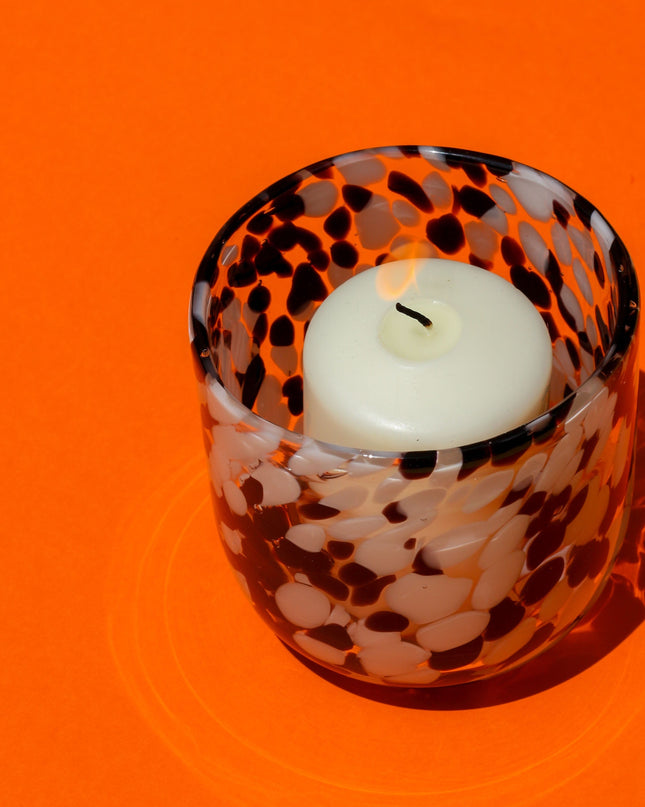 White Black Blown Glass Candle holder on an orange background