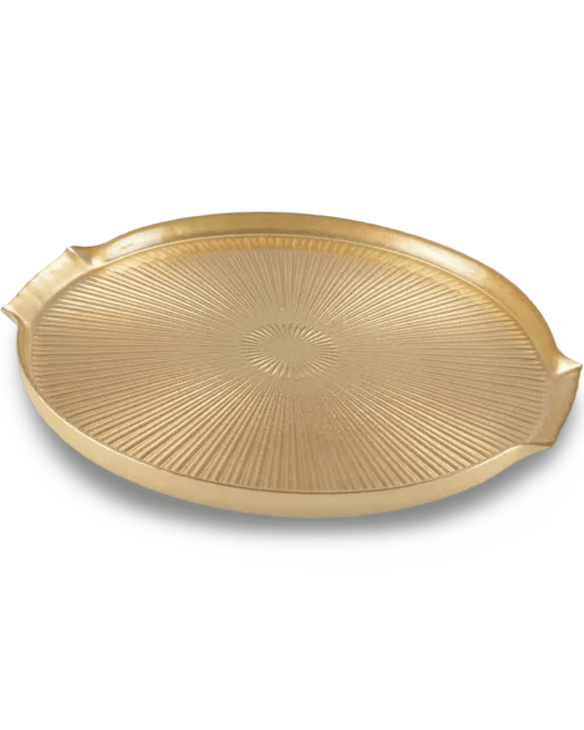 Gold decorative glass tray with sunburst pattern on a white background