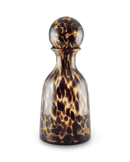 Leopard patterned bottle carafe with stopper on a white background