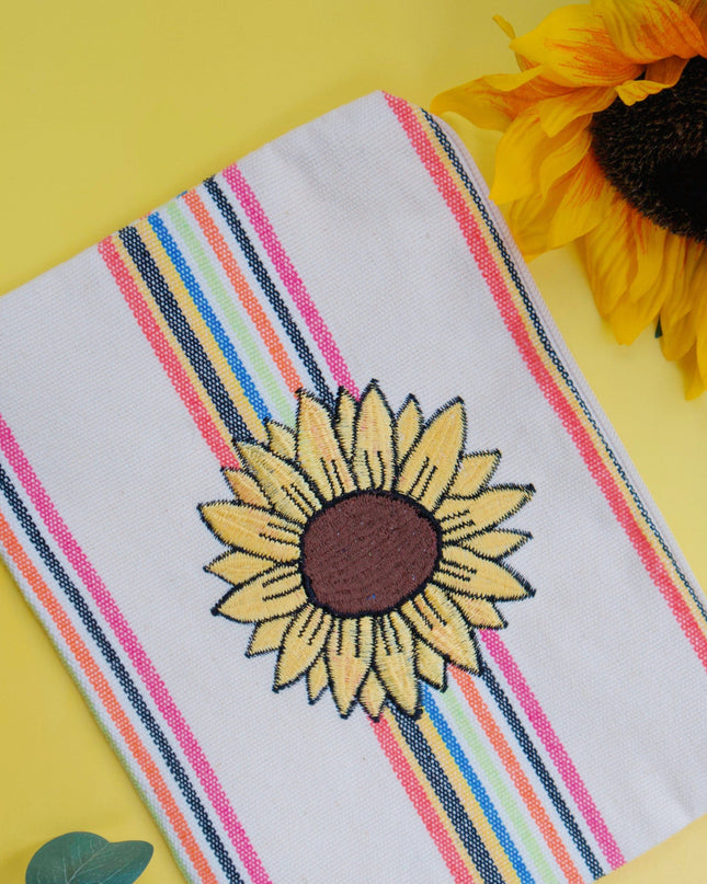 Striped cosmetic pouch with sunflower design on a yellow background