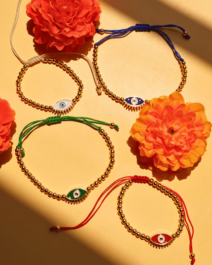 Beaded Evil Eye Bracelets on a Yellow Background