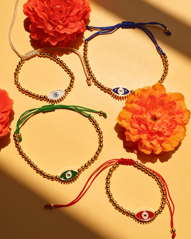 Beaded Evil Eye Bracelets on a Yellow Background