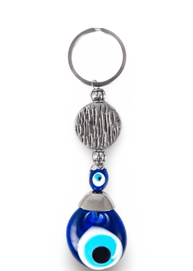 Keychain with blue evil eye charm and silver accents on a white background