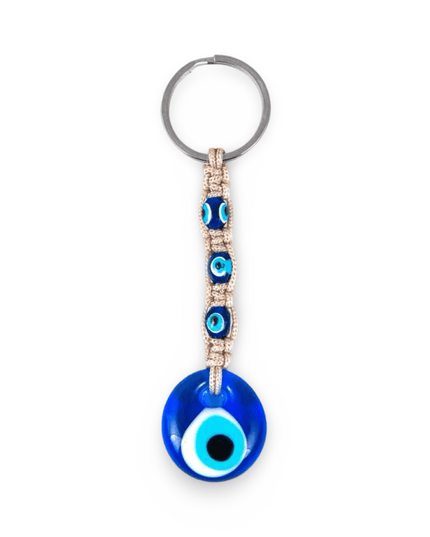 Keychain with blue evil eye design and beige macrame on a white background