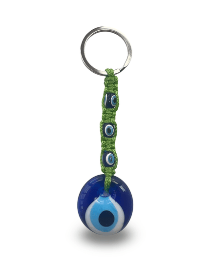 Keychain with blue evil eye charm and green macrame on a white background