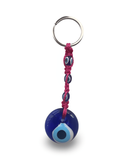 Keychain with blue evil eye charm and hot pink macrame on a white background
