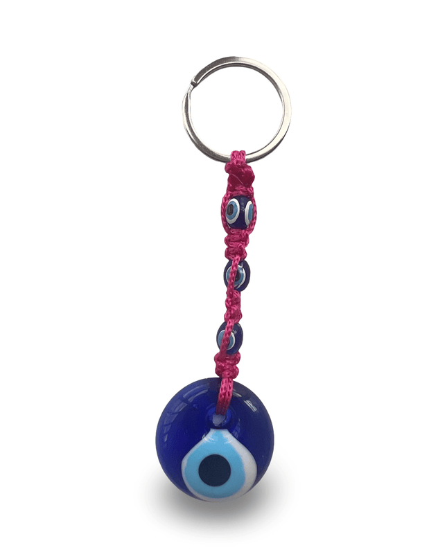 Keychain with blue evil eye charm and hot pink macrame on a white background