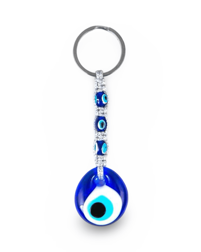 Keychain with blue evil eye design and macrame on a white background