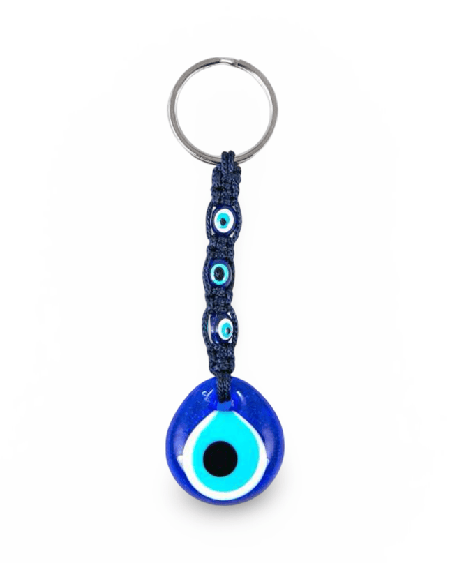 Blue evil eye keychain with navy macrame on a white background