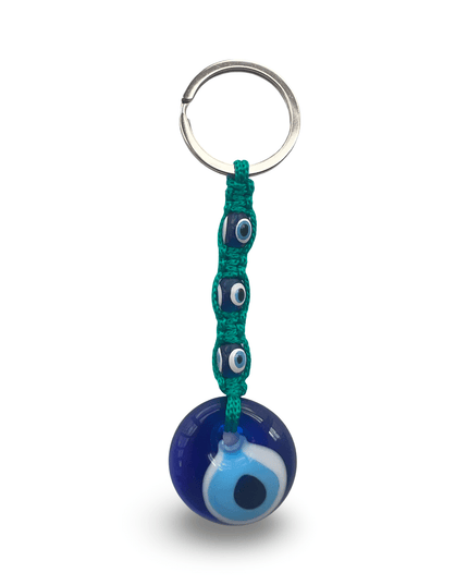 Keychain with blue evil eye charm with teal macrame on a white background
