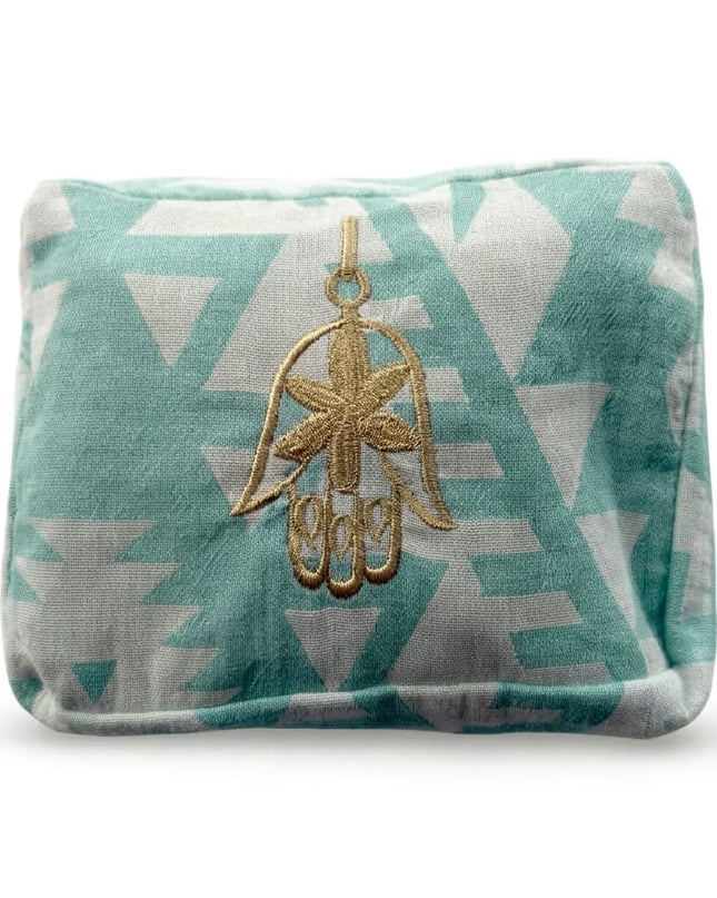 Cyan Ohana Cosmetic Pouch with hand-embroidered evil eye design