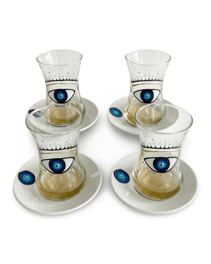 Four Big Eye Nazar teacups with a hand-painted blue evil eye on a white background