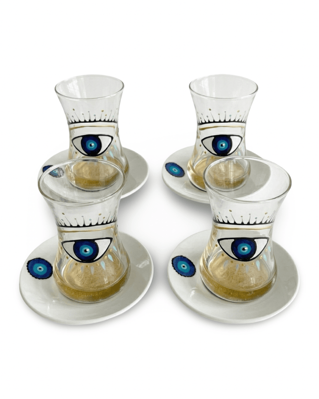 Four Big Eye Nazar teacups with a hand-painted blue evil eye on a white background