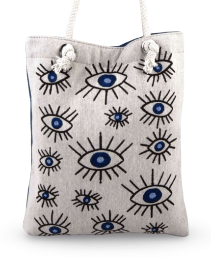 Canvas tote bag with evil eye pattern on a white background