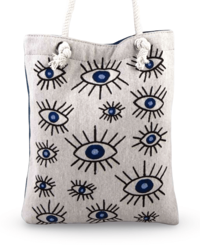 Canvas tote bag with evil eye pattern on a white background