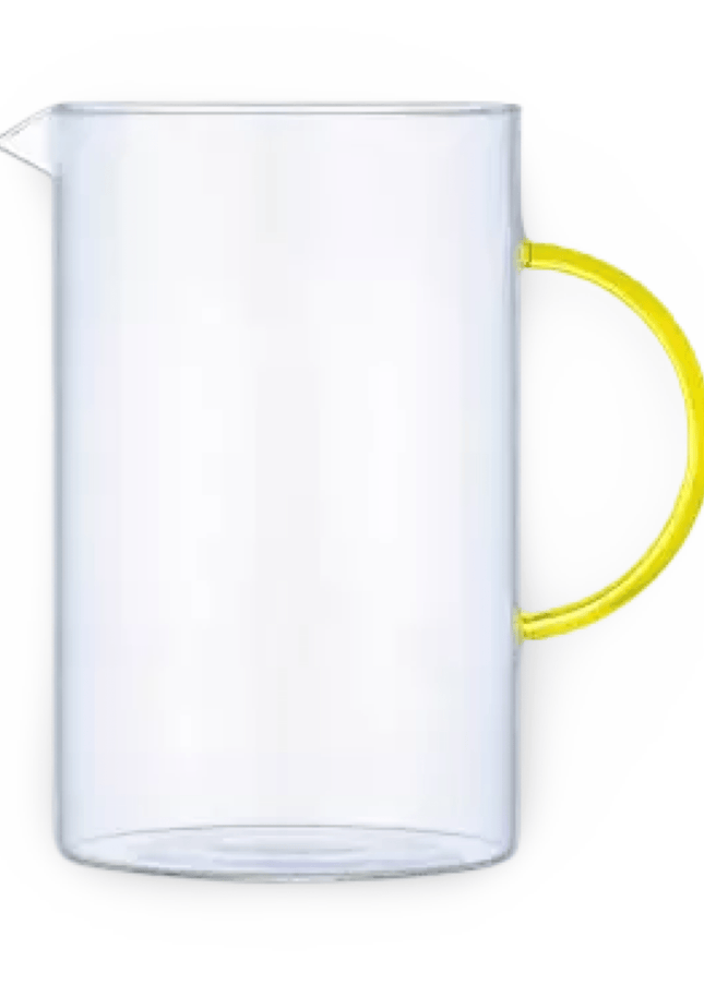 Glass Pitcher with Yellow Handle on White Background