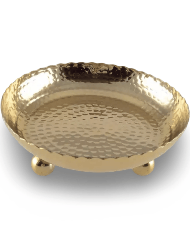 Hammered Gold decorative bowl with round feet on a white background