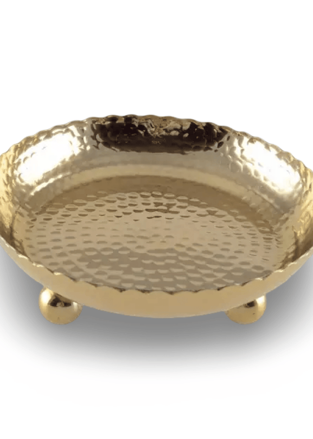 Hammered Gold decorative bowl with round feet on a white background