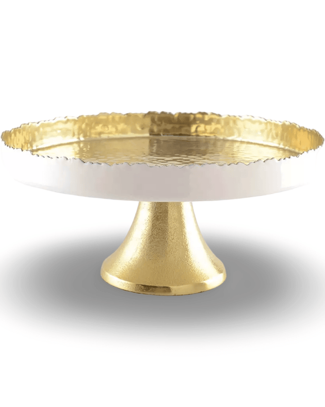Gold cake stand with textured top and solid base on a white background