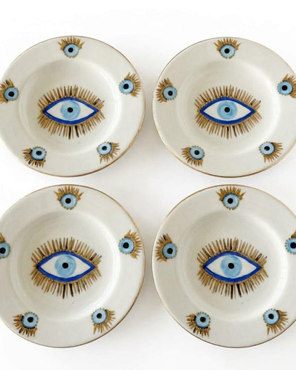 Rawan liquid gold evil eye ceramic dessert plates styled on a table