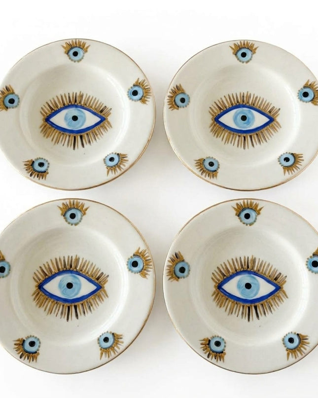 Rawan liquid gold evil eye ceramic dessert plates styled on a table