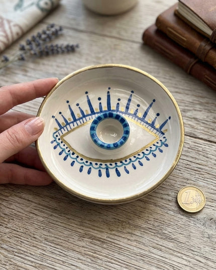 Shanti Palo Santo Holder held in hand next to a coin for size reference