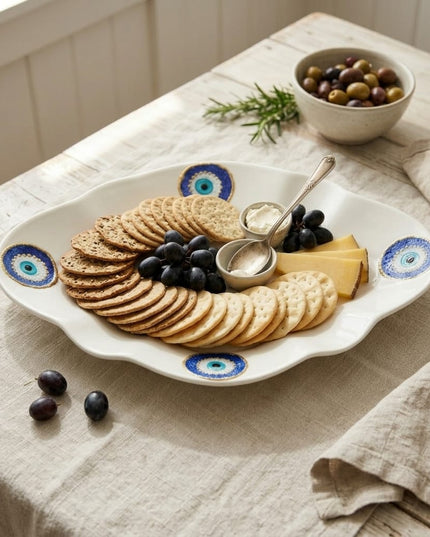 Ghayma scalloped evil eye dessert plates styled on a table
