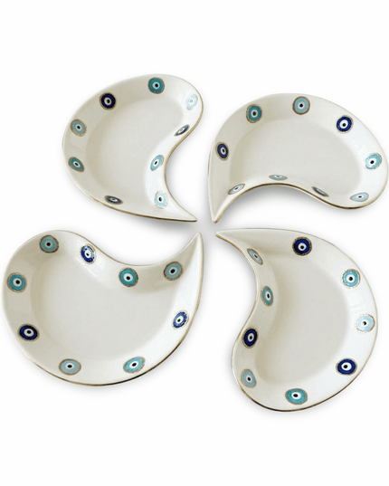 Hilal crescent porcelain dessert plates with evil eye design styled on a table with sweets