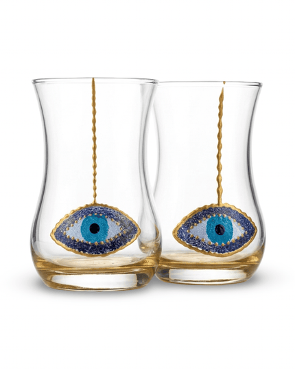 Close-up of hand-painted blue evil eye on a Neela glass tea glass, handmade in Jordan