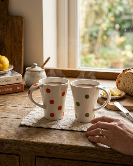 Set of 2 Bindi polka dot porcelain mugs, one green and one orange