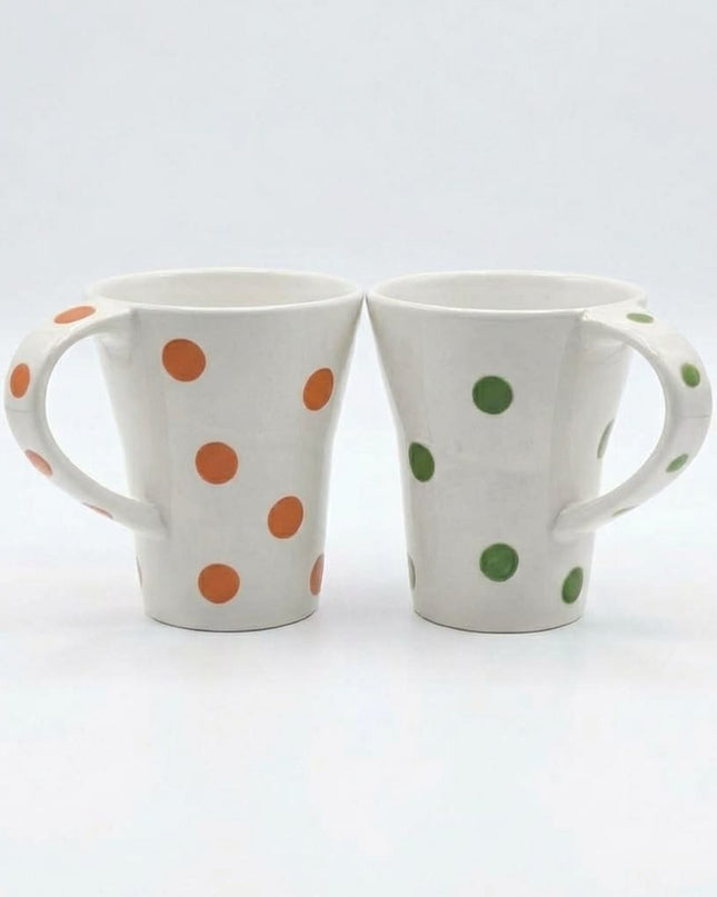 Green and orange Bindi white porcelain mugs with handles, hand-painted with polka dots