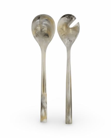 Two gray resin salad servers on a white background