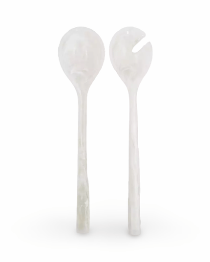 Two white resin salad servers on a white background