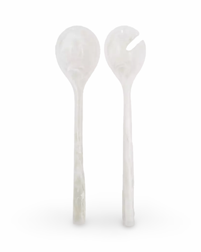 Two white resin salad servers on a white background