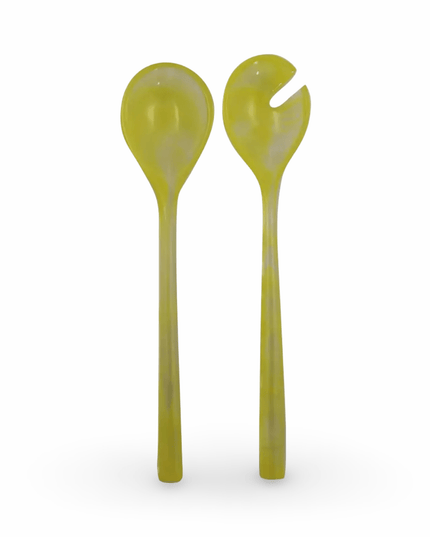 Two yellow resin salad servers on a white background