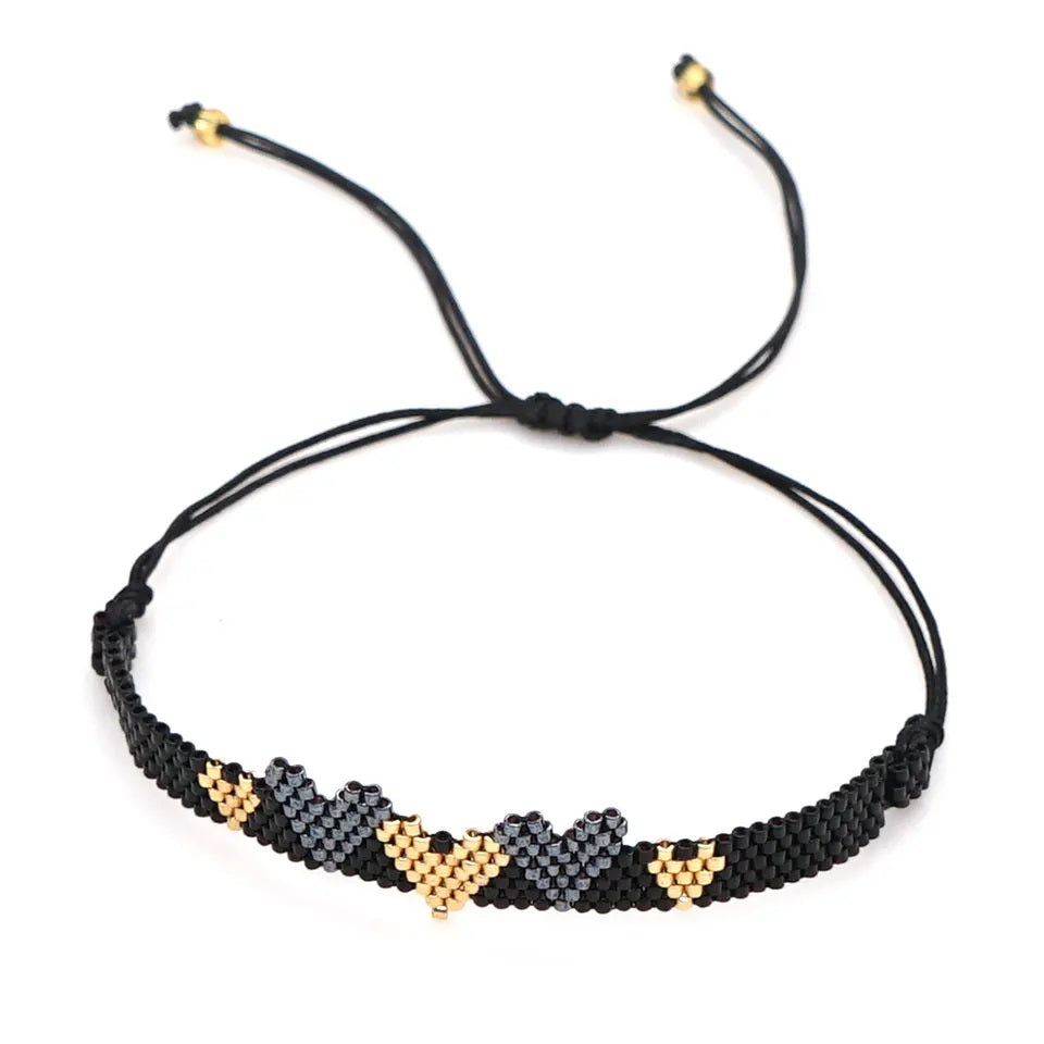 Black Beaded Bracelet with Black and Gold Hearts