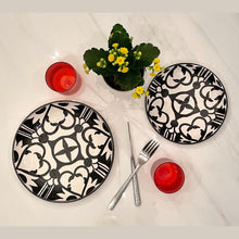 Load image into Gallery viewer, Handpainted Ceramic Black White Geometric Plates Red Water Glass Hammered Silver Cutlery
