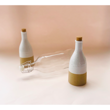 Load image into Gallery viewer, Two Beige Ceramic Bottles with Cork and a Glass Bottle
